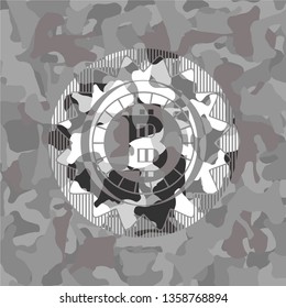 bitcoin icon inside grey camouflage texture