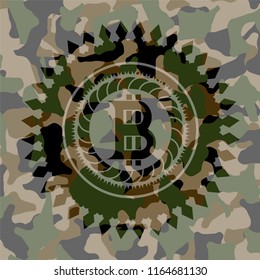 bitcoin icon on camo texture