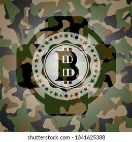 bitcoin icon on camo texture