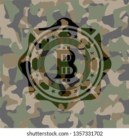 bitcoin icon on camo texture