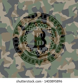 bitcoin icon on camouflaged pattern
