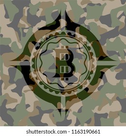 bitcoin icon on camouflaged texture
