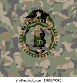 bitcoin icon on camouflaged texture