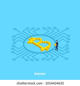 bitcoin lies on the chip and emits glow, an isometric image