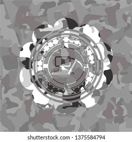 bitcoin mining icon inside grey camouflage emblem
