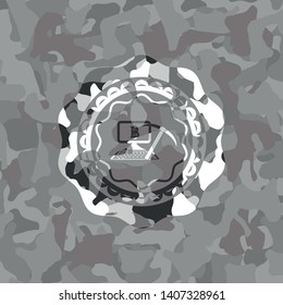 bitcoin mining icon inside grey camouflage emblem