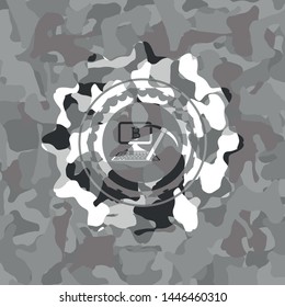 bitcoin mining icon inside grey camouflaged emblem