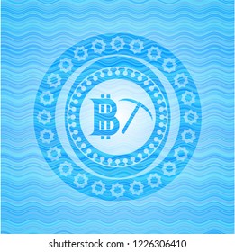 bitcoin mining icon inside sky blue water emblem.
