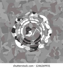 bitcoin mining icon on grey camouflaged pattern