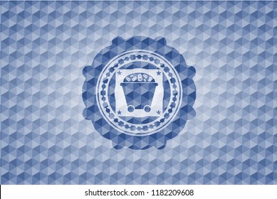 Bitcoin mining trolley icon inside blue badge with geometric pattern background.