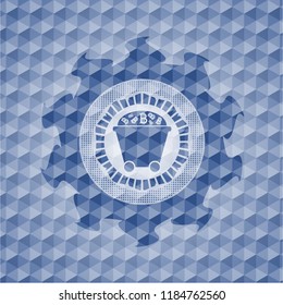 Bitcoin mining trolley icon inside blue emblem with geometric pattern background.