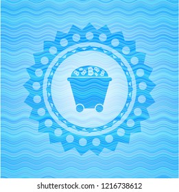 Bitcoin mining trolley icon inside light blue water wave style badge.