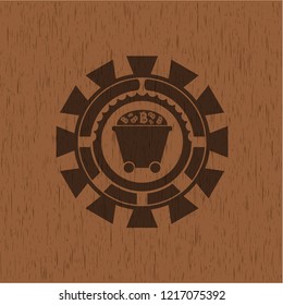 Bitcoin mining trolley icon inside wooden emblem