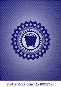 Bitcoin mining trolley icon inside jean or denim emblem or badge background