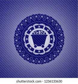Bitcoin mining trolley icon inside emblem with jean background