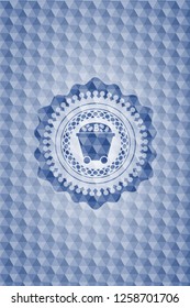 Bitcoin mining trolley icon inside blue badge with geometric background.