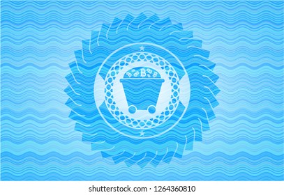 Bitcoin mining trolley icon inside water wave representation badge.