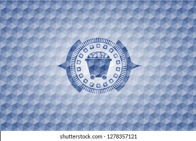 Bitcoin mining trolley icon inside blue emblem or badge with abstract geometric pattern background.