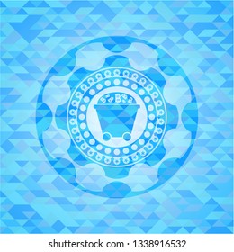 Bitcoin mining trolley icon inside sky blue emblem with mosaic background