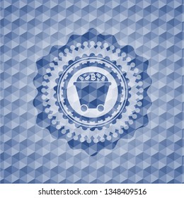 Bitcoin mining trolley icon inside blue emblem or badge with geometric pattern background.
