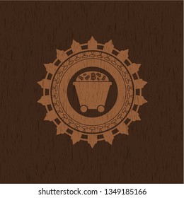 Bitcoin mining trolley icon inside badge with wood background