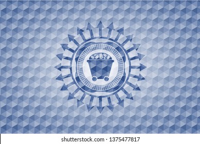 Bitcoin mining trolley icon inside blue polygonal emblem.