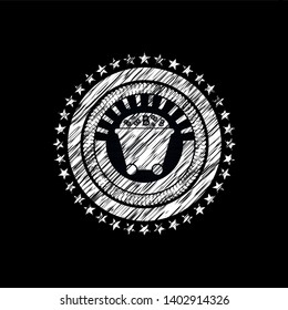 Bitcoin mining trolley icon inside chalk emblem written on a blackboard