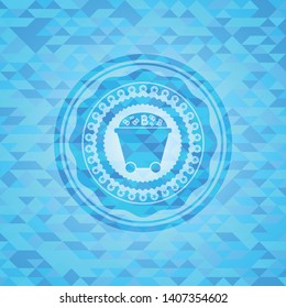 Bitcoin mining trolley icon inside sky blue emblem with mosaic background