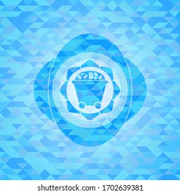 Bitcoin mining trolley icon inside light blue mosaic emblem. 
