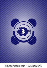 bitcoin piggy bank icon inside emblem with jean texture