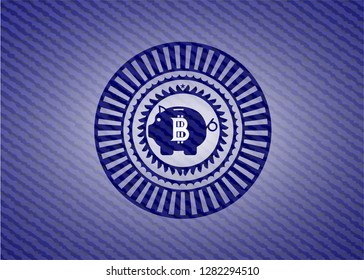 bitcoin piggy bank icon inside jean or denim emblem or badge background