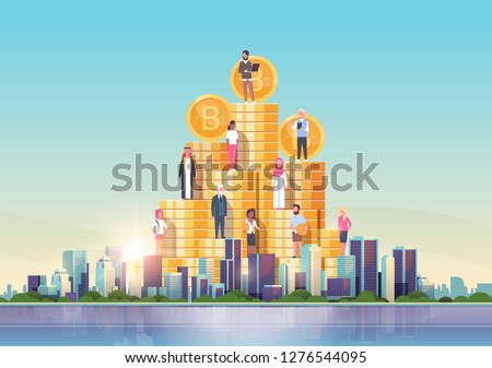 bitcoin virtual money people standing at golden coins stack crypto currency mining concept over big modern city building skyscraper cityscape skyline flat horizontal