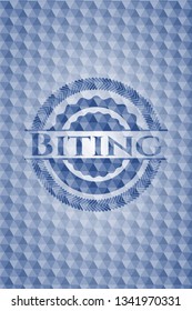Biting blue emblem with geometric background.