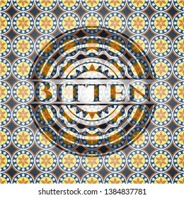 Bitten arabic badge. Arabesque decoration.