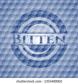 Bitten blue emblem with geometric background.
