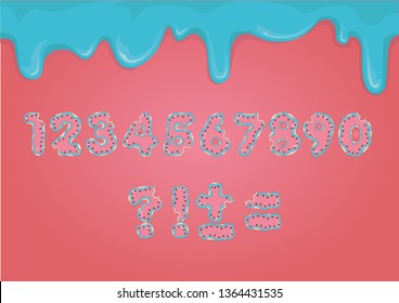 Bitten delicious numbers and punctuation marks in the form of cookies with watermelon icing