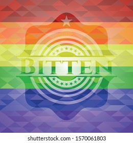 Bitten emblem on mosaic background with the colors of the LGBT flag