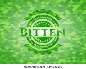 Bitten green emblem with mosaic background