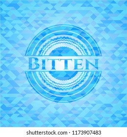 Bitten light blue emblem. Mosaic background