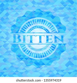 Bitten light blue emblem with triangle mosaic background