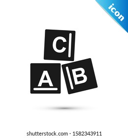 Black ABC blocks icon isolated on white background. Alphabet cubes with letters A,B,C.  Vector Illustration