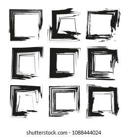 Black abstract textured square smears isolated on a white background
