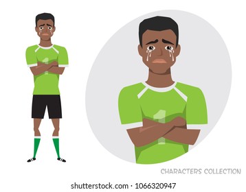The black african american football player crossed his arms and cries. Mans tears and depression. The emotion of disappointment and sadness at the soccer player face. The male was crying