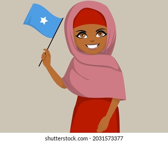 Mujeres somalíes de África negra sosteniendo y ondeando la bandera de Somalia