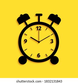 Black Alarm clock icon isolated on yellow background. Wake up, get up concept. Time sign. Long shadow style. Vector.