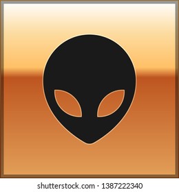 Black Alien icon isolated on gold background. Extraterrestrial alien face or head symbol. Vector Illustration
