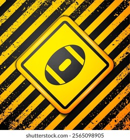 Black American Football ball icon isolated on yellow background. Rugby ball icon. Team sport game symbol. Warning sign. Vector