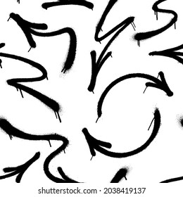 Black arrows made from spray paint on white background. Vector seamless pattern