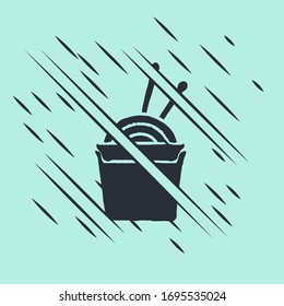 Black Asian noodles in paper box and chopsticks icon isolated on green background. Street fast food. Korean, Japanese, Chinese food. Glitch style. Vector Illustration