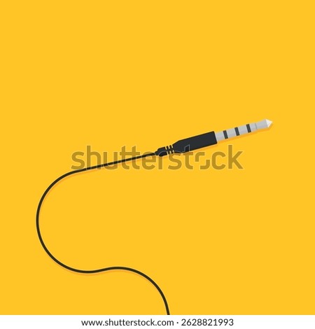 Black audio jack cable on a yellow background, showing the connector with three rings.